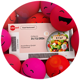 Ein Edenred-Ticket-Restaurant–Gutschein umgeben von lachenden und zwinkernden pinkfarbenen Emoji-Kugeln vor hellem Hintergrund.